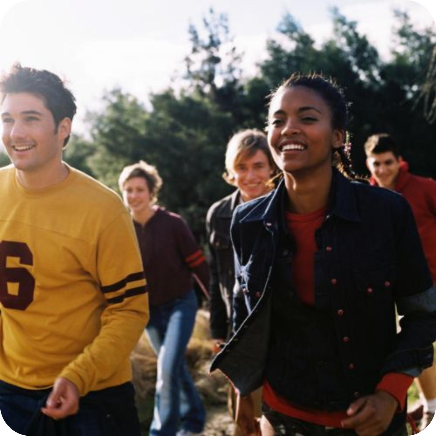 Group of people exercise outside