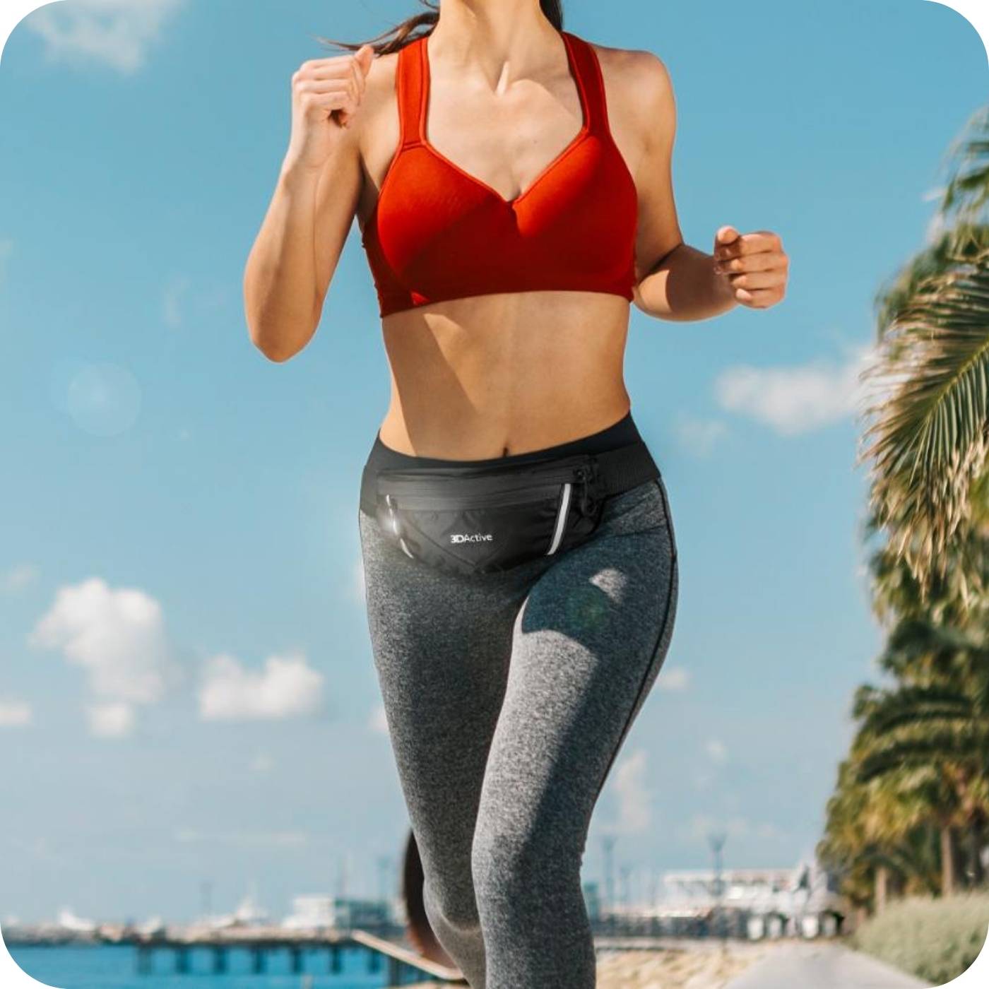 woman running along the promenade using her 3dactive running belt