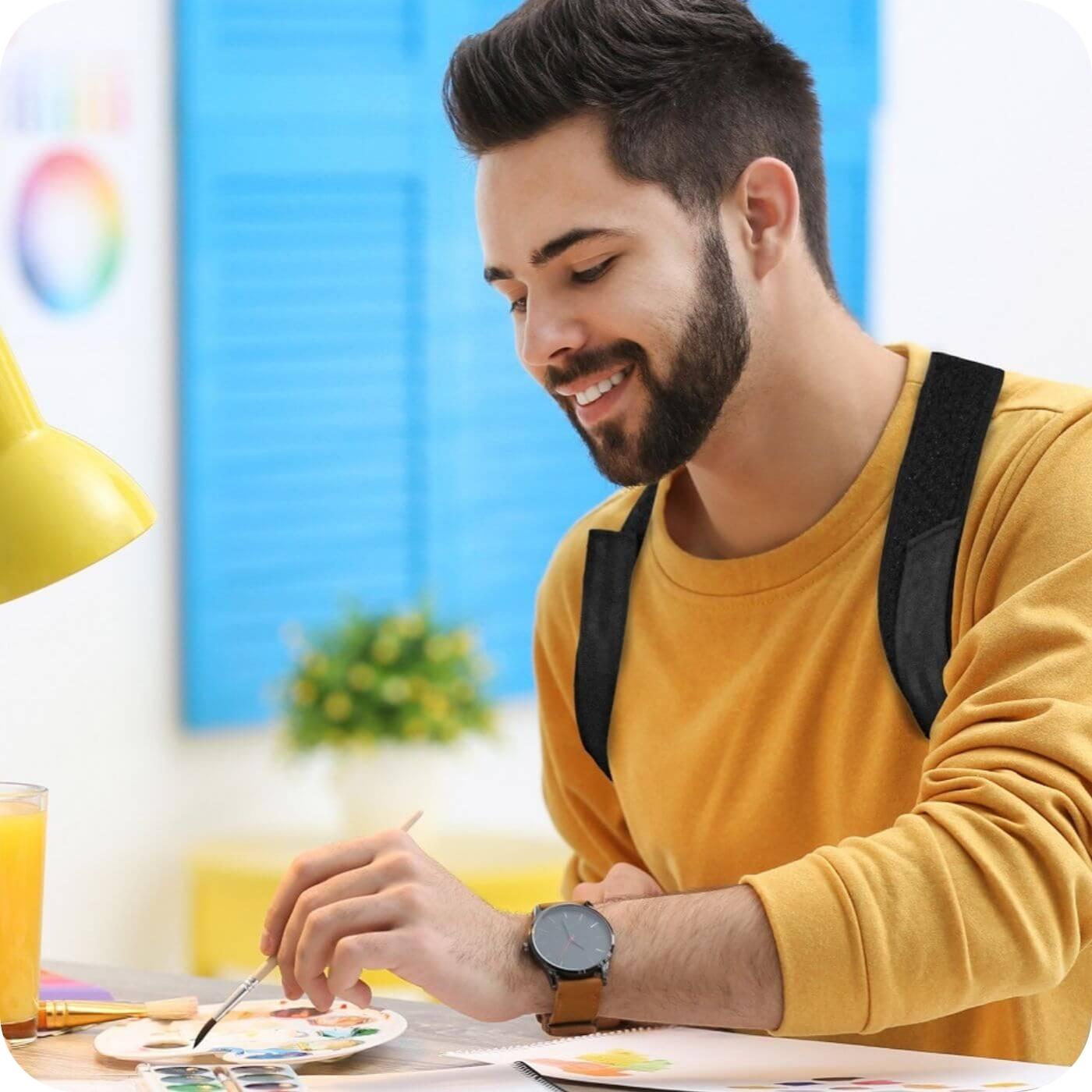 man sitting at his desk working whilst wearing his 3dactive posture corrector to maintain a good posture.