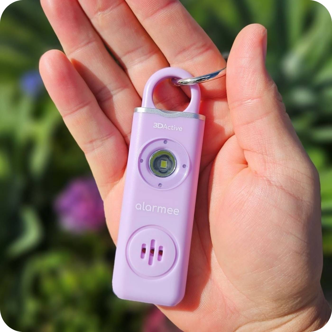 alarmee self defense keychain in the palm of your hand