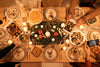 Overhead shot of Christmas dinner table decorated and with food.