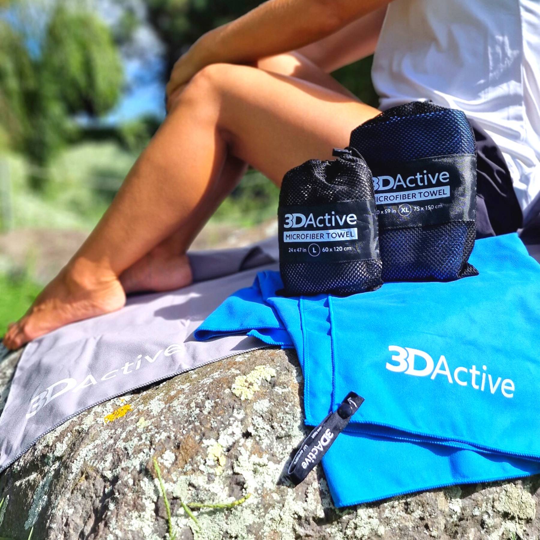 Woman sitting on rock with 3DActive Microfiber Towels