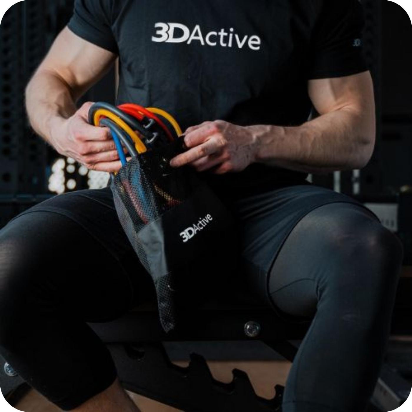 Man taking his 3DActive Resistance Bands with Handles out the carry bag 