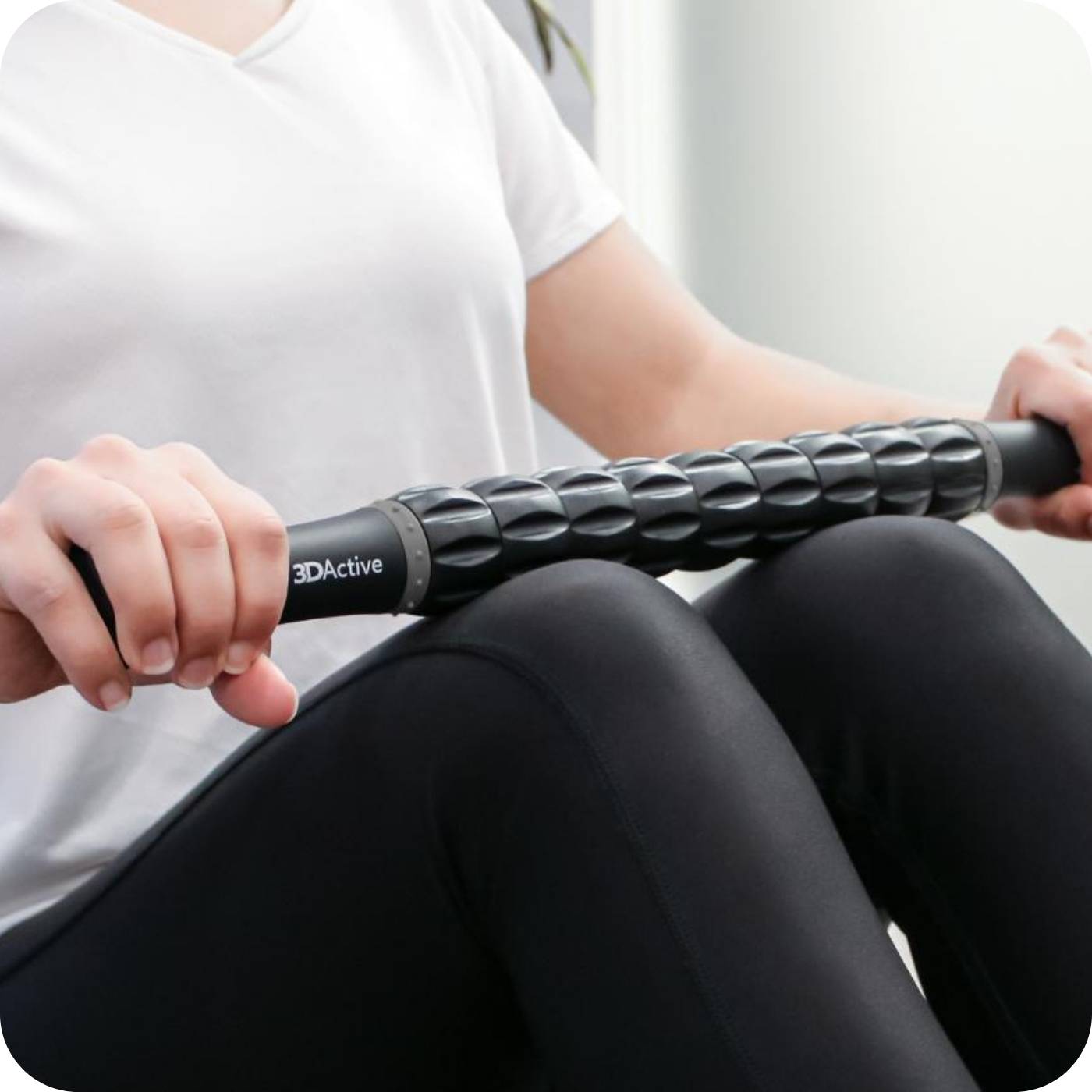 woman massaging her legs with her 3DActive massage roller stick 