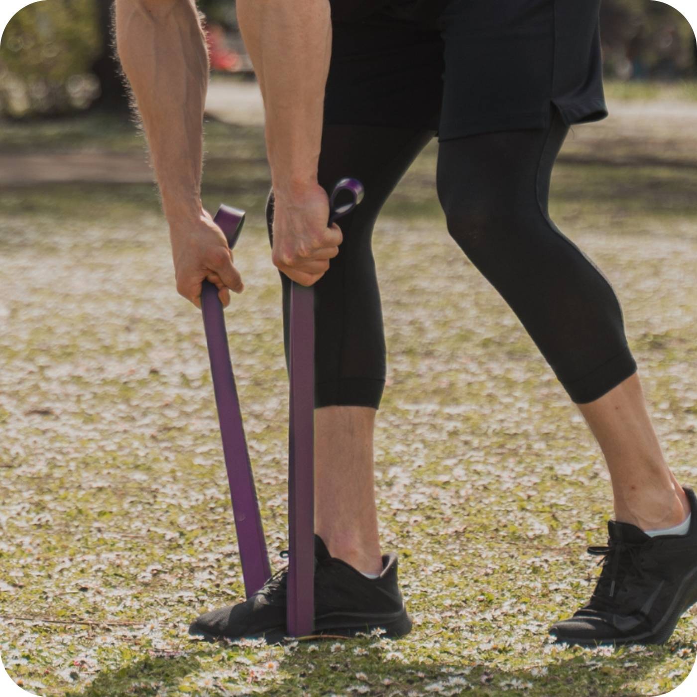 man using 3dactive purple resistance band in the park