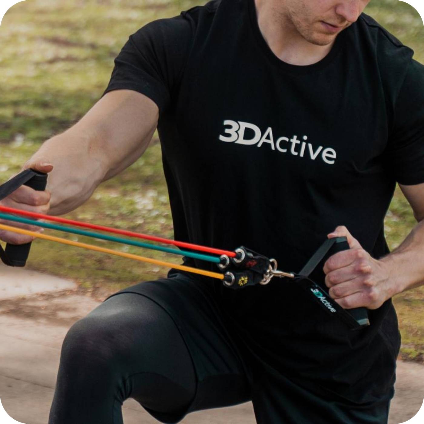 man using the 3dactive resistance bands with handles in the outdoor gym