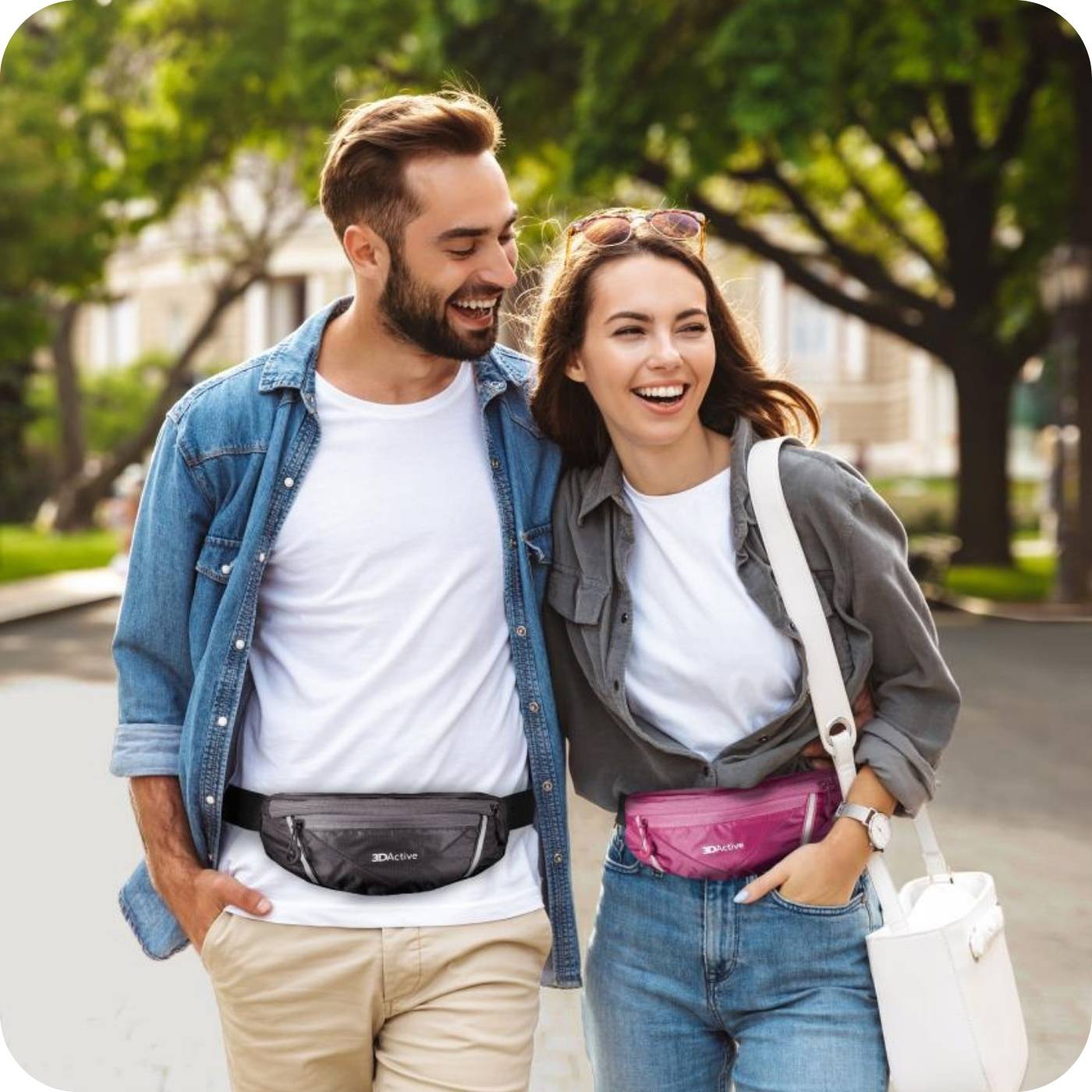 couple walking through the park with their 3dactive running belts around their waists. 