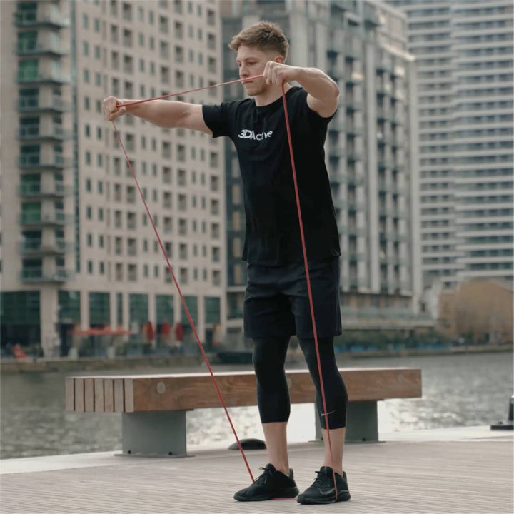 man using a red resistance band