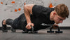 Muscular man doing a push-up using 3DActive Push Up Bars