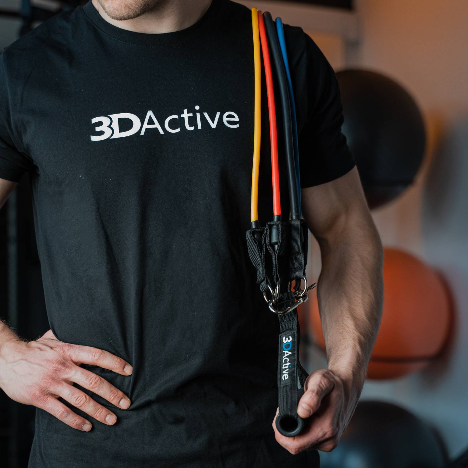 man holding set of 3DActive resistance bands in the gym